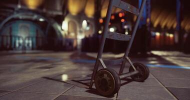 CGI Metal cart on wheels in an abandoned industrial setting during evening hours video