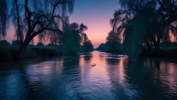 River Flowing Through Trees at Twilight with Pastel Sky Reflection photo