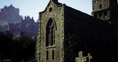 CGI Medieval stone church with ornate windows surrounded by fortress ruins video