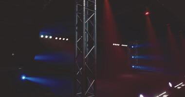CGI Stage lights illuminate an empty performance area before a show in evening video