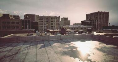 CGI City skyline viewed from a rooftop during sunset with urban architecture video