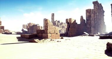CGI Ancient ruins emerge from the sandy desert under a bright blue sky video