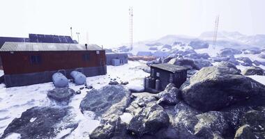 CGI Remote research station in snowy landscape with rocky terrain during daylight video