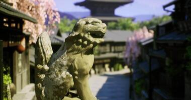 CGI Historic stone guardian statue stands watch over ancient town in springtime video