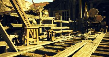 CGI Old wooden machinery on a mining site under warm sunlight in the desert video