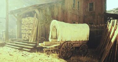 CGI Old wooden wagon next to rustic building in sunlit outdoor setting video