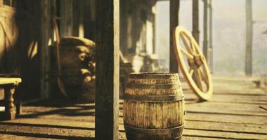 CGI Wooden barrel on an old wooden dock surrounded by rustic equipment video