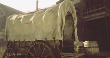 CGI Vintage wagon on wooden wheels near barrels in a rustic setting video