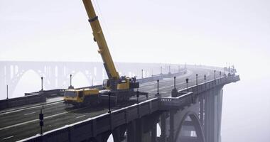 CGI Crane positioning on bridge under foggy weather conditions video