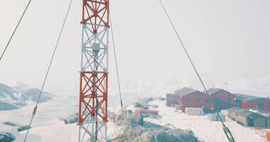 CGI Snowy landscape with communication tower near remote research station video