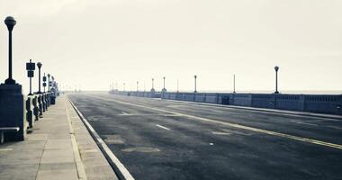 CGI Long empty road leading to the horizon in a foggy coastal setting video