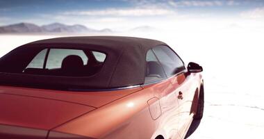 CGI Convertible car parked on a vast salt flat with mountains in the background video