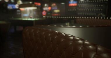 CGI Cozy leather seating in a dimly lit lounge with pool table in background video