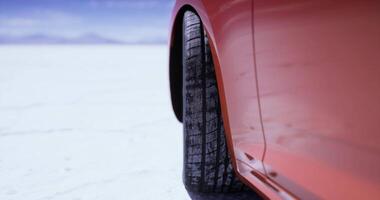 CGI Close up view of a car tire on a salt flat during daylight video