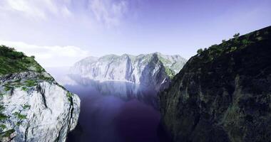 CGI Stunning cliffs and tranquil waters at a serene bay during midday video
