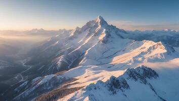 Snow Covered Mountain Peak at Golden Hour with Winter Landscape photo