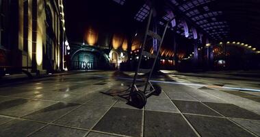CGI Empty cart waits in a dimly lit train station with colorful lights at night video