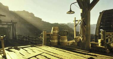 CGI Rustic wooden dock bathed in sunlight with barrels and tools at sunset video