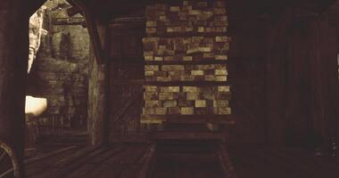 CGI Old wooden structure with stacked logs in a rustic setting near a wagon video