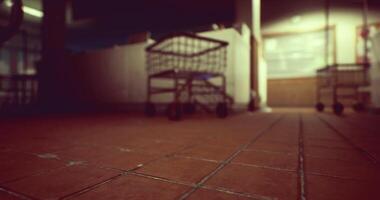 CGI Shopping carts on a tiled floor in a dimly lit store aisle at night video