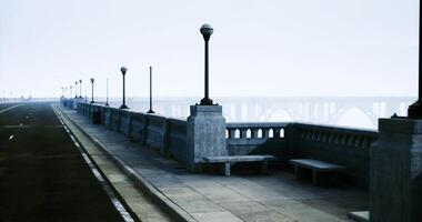 CGI Serene coastal walkway with lamp posts during calm overcast day video