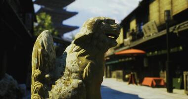 CGI Ancient stone lion statue in traditional street setting during daylight hours video