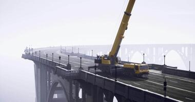 CGI Crane operations on a bridge during foggy weather in a remote location video