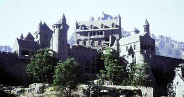 CGI Majestic medieval castle perched on rocky terrain surrounded by greenery video