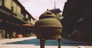 CGI Pottery vessel in an ancient street with traditional architecture at dusk video