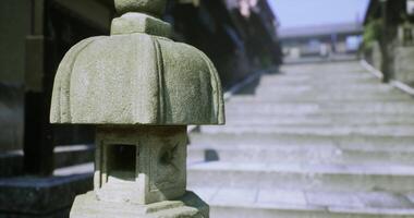 CGI Stone lantern by ancient steps leading to a shrine at sunrise video