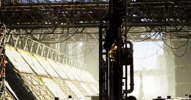 CGI Sunlit industrial landscape with complex structures and cables video