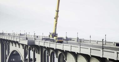 CGI Construction equipment working on a bridge during overcast weather video