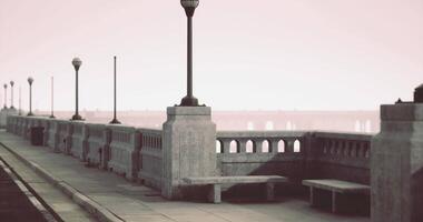 CGI Beautiful walkway with lamp posts along the river at sunrise video