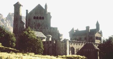 CGI Ancient castle sits majestically on a hill surrounded by lush greenery video