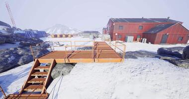 CGI Unique red building and wooden walkway in a snowy remote location video