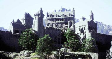 CGI Majestic medieval castle perched on a hillside surrounded by trees video