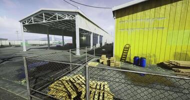 CGI Industrial setting in a warehouse area with yellow building and storage video