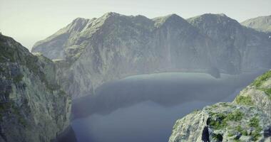CGI Scenic view of a tranquil lake surrounded by majestic mountains video