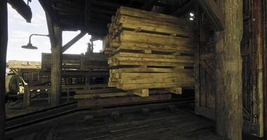 CGI Wooden planks stacked in a rustic warehouse during daylight video