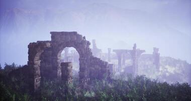 CGI Ruins of an ancient structure surrounded by mist and greenery at dawn video