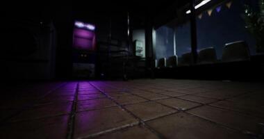 CGI Dimly lit interior of a quiet laundry room during late evening hours video