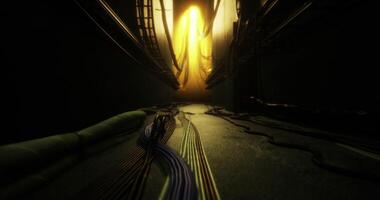 CGI Intricate network of cables leading to a bright yellow light in a dark corridor video