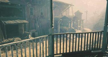 CGI Foggy landscape with rustic wooden buildings evokes history and solitude video