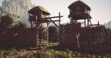 CGI Structure and fortification in a mountainous landscape with wooden towers video