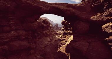 CGI Exploring rocky landscape with sunlight illuminating ancient formations video