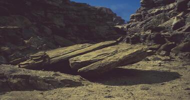 CGI Unique rock formation in a sunlit desert landscape during midday video