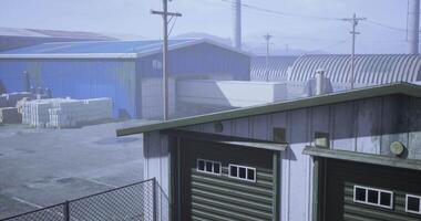 CGI Industrial storage area with warehouses and power lines in overcast weather video