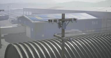 CGI Power lines stretch across an industrial area in a misty environment video