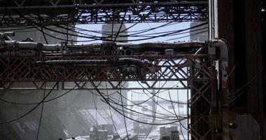 CGI Urban decay with snow covering an industrial area filled with tangled wires video