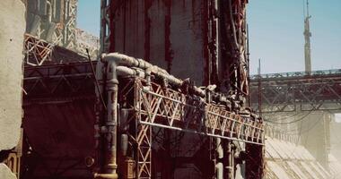 CGI Rusty industrial structure with intricate piping in an abandoned location video